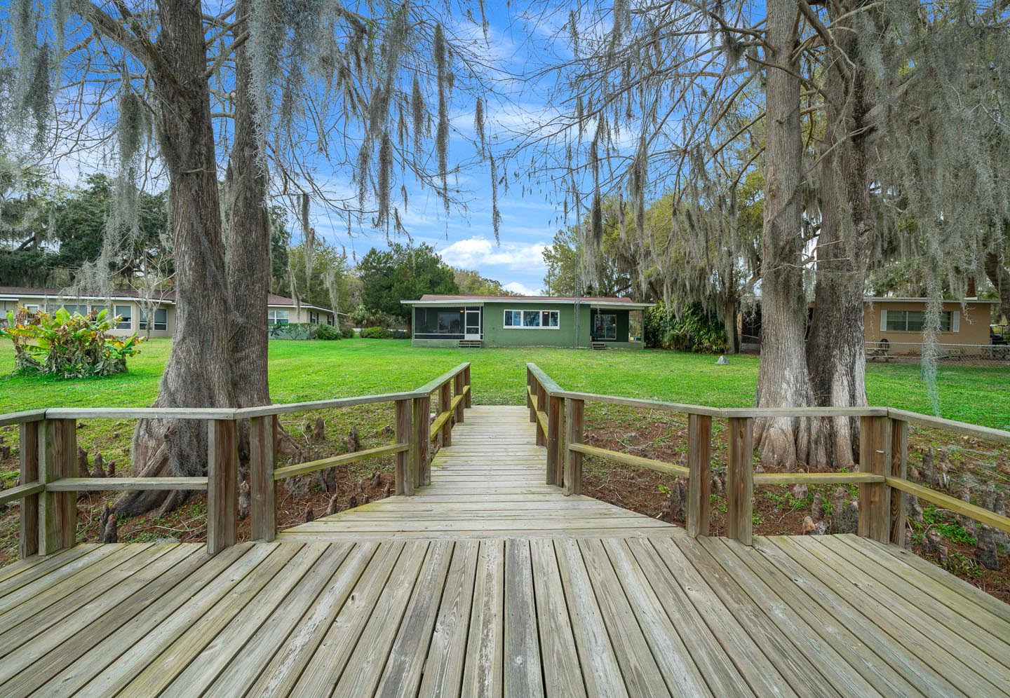 real estate picture of a dock and house